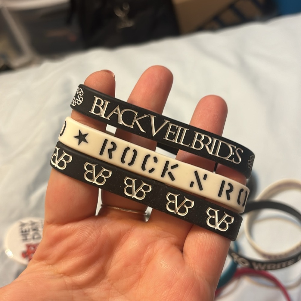 Bundle of Rubber bracelets Black veils brides, motionless in white